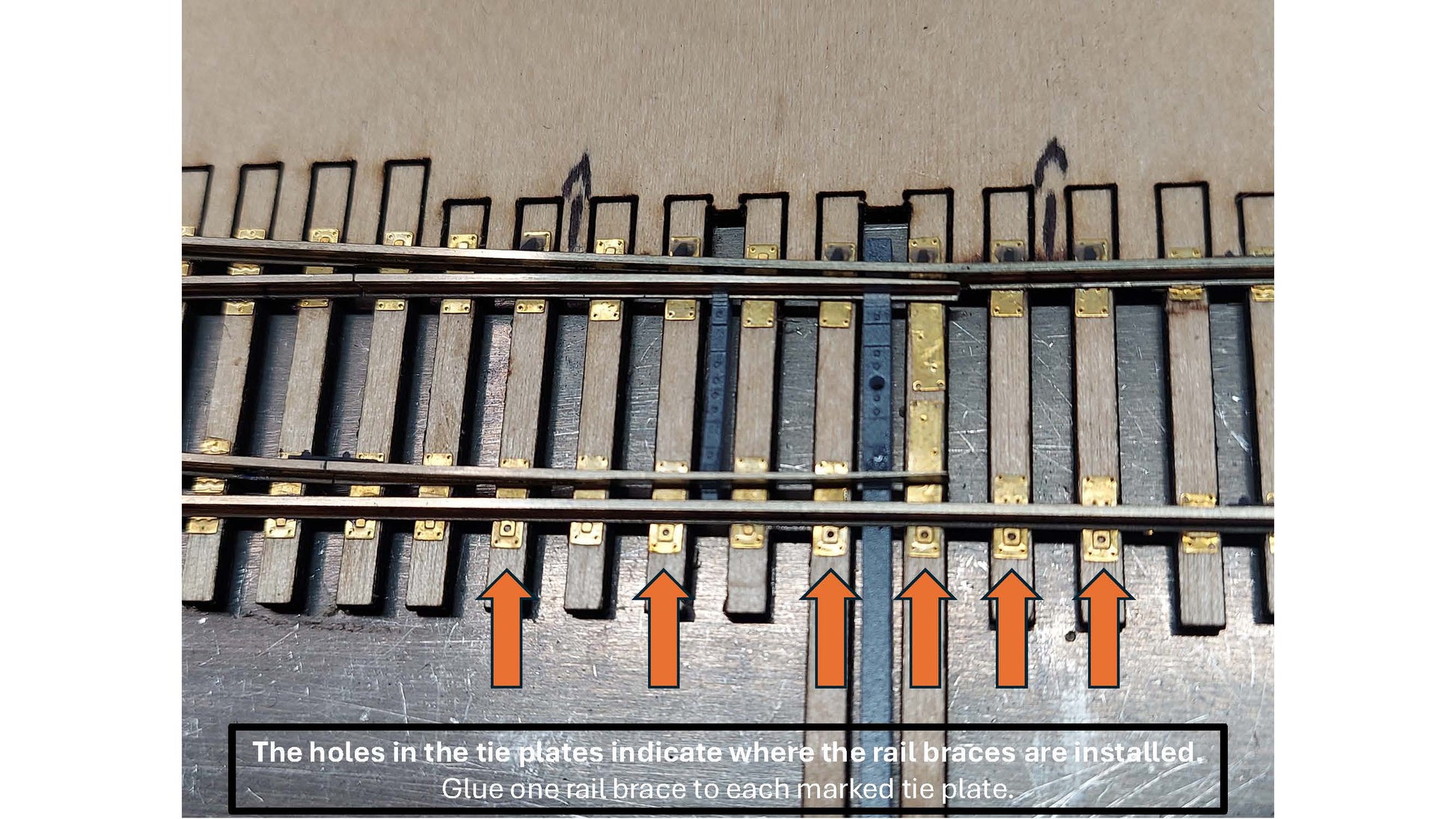 Roadmaster Series HO turnout tie plates showing locating holes that indicate where rail braces are installed.
